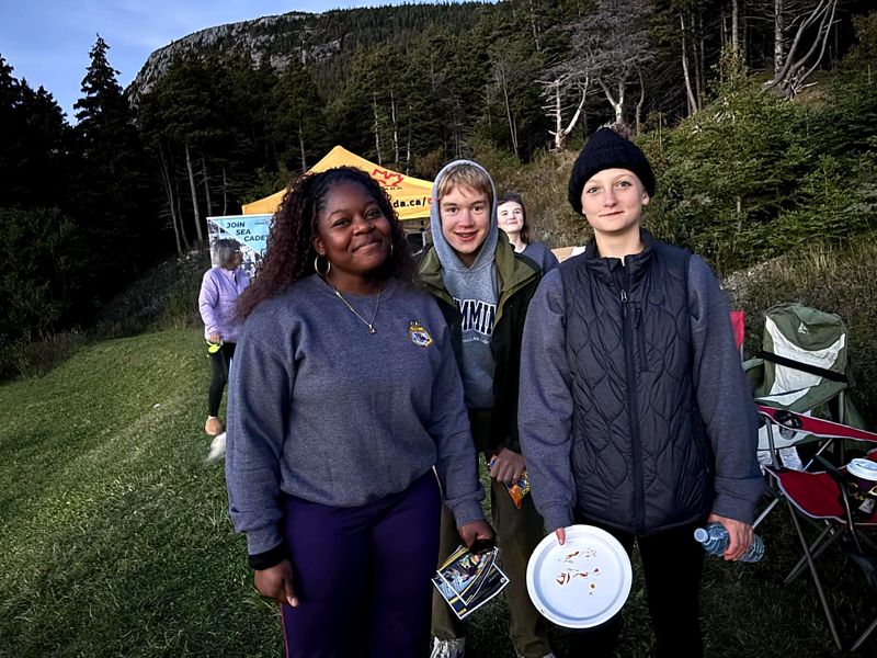 Three cadets by the tent